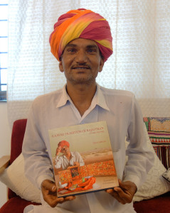 Dx Kojaram Holding the book